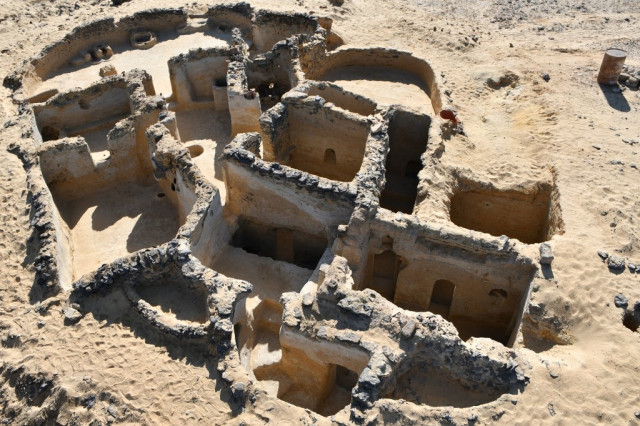 A handout picture released by the Egyptian Ministry of Tourism and Antiquities on March 13, 2021 shows a view of an ancient Christian structure carved in the bedrock dating back to the 5th century AD, discovered in the Tal Ganoub Qasr Al-Ajouz site in the Western Desert Bahariya Oasis. - A French-Norwegian archaeological mission unearthed ancient Christian structures built with basalt rock or carved in the rock face including scribbles and symbols of Coptic connotations, while others were mudbrick buildings dating back to between the 4th and 7th centuries AD, a find denoting a monastic life in the area since the fifth century AD, according to the Egyptian Ministry of Tourism and Antiquities. (Photo by - / Egyptian Ministry of Antiquities / AFP) / === RESTRICTED TO EDITORIAL USE - MANDATORY CREDIT 